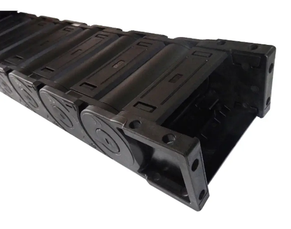 End detail of full black enclosed drag chain, black plastic drag chain